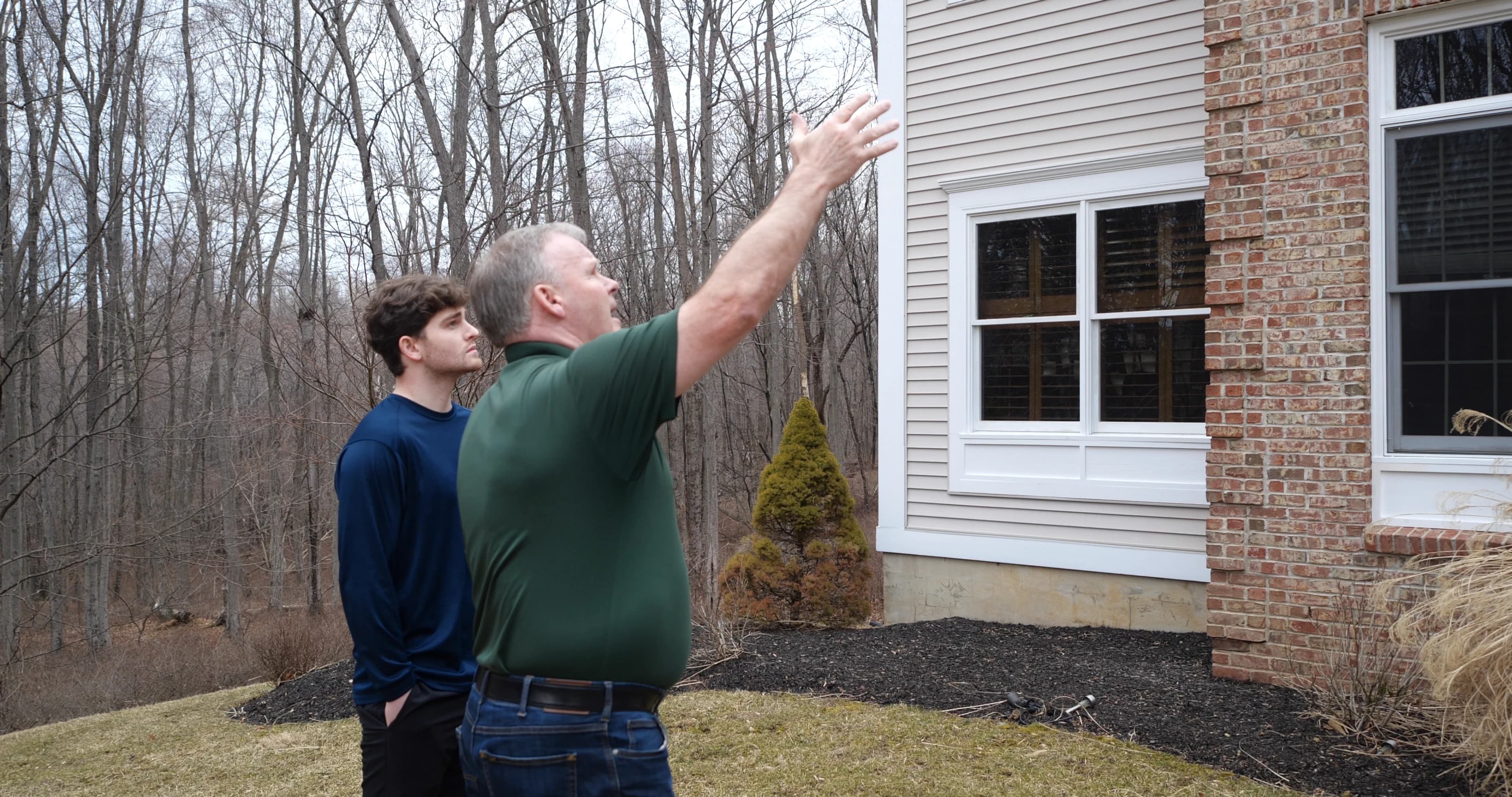 Hennebry technician providing pest control service outdoors