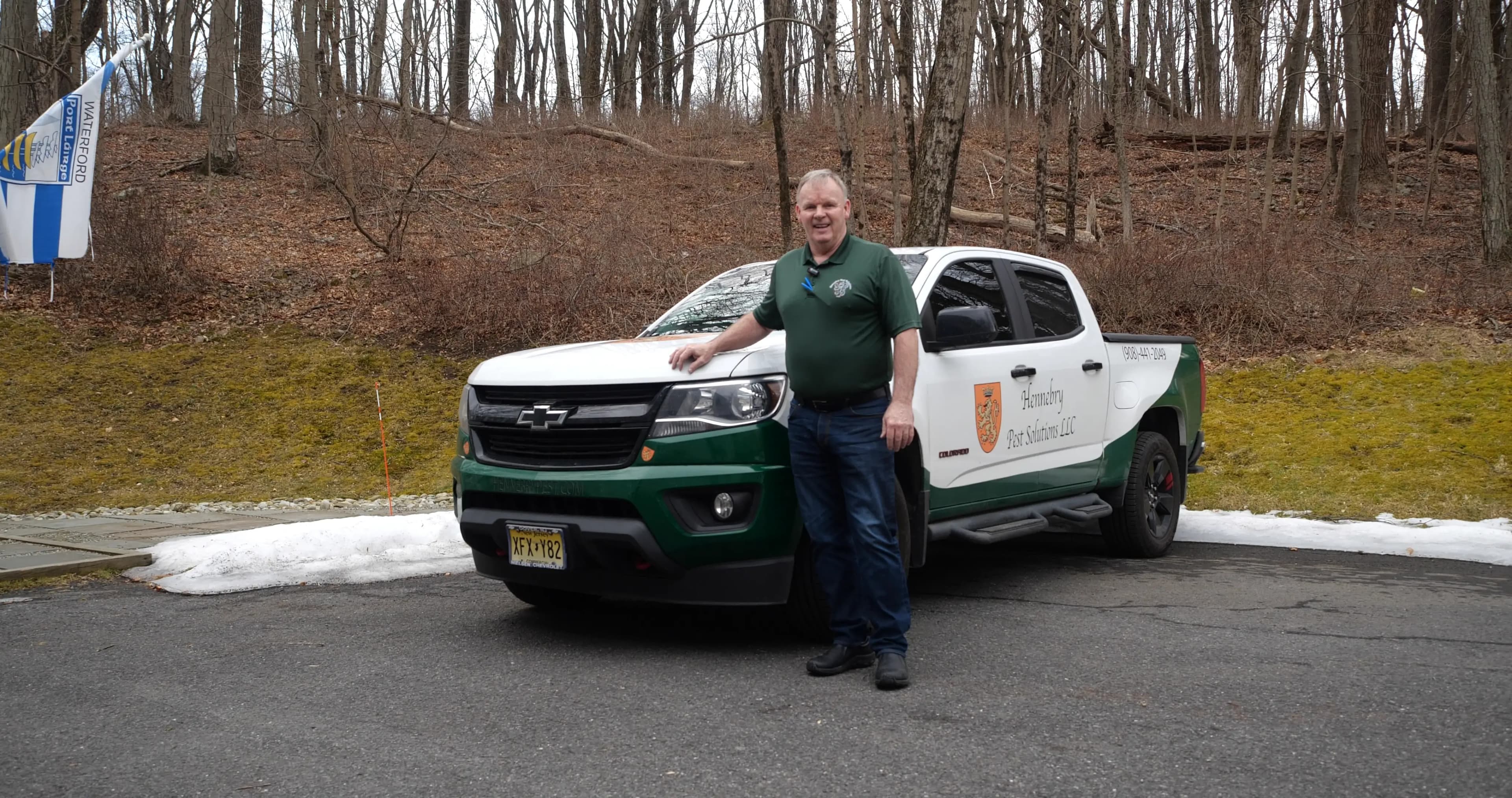 Hennebry Pest Solutions technician with company service truck